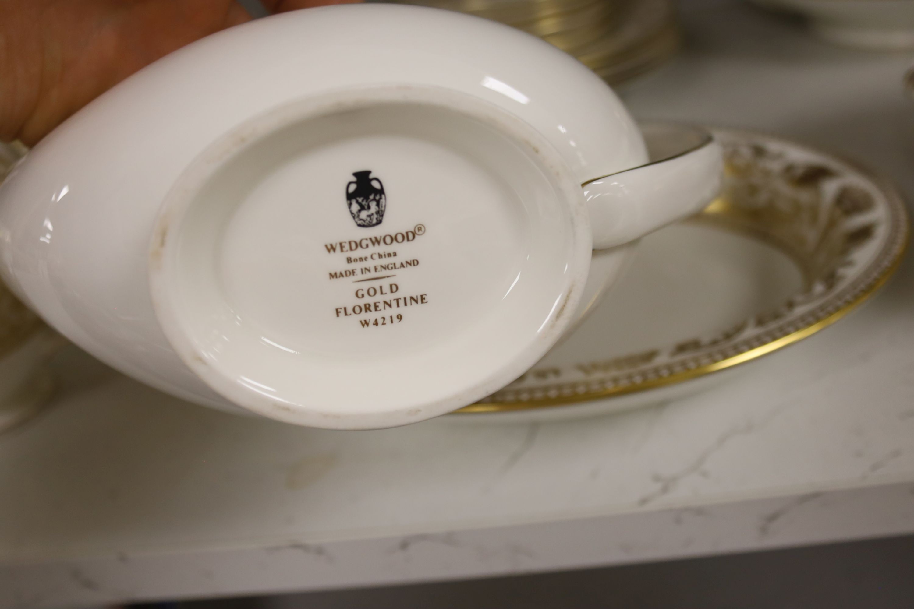 A Wedgwood Gold florentine pattern part tea coffee and dinner service